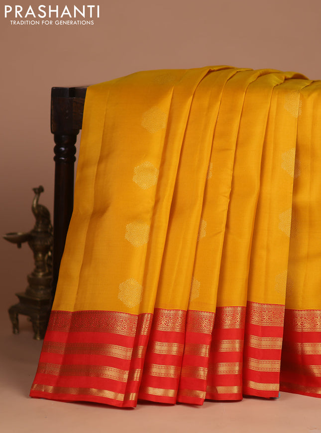 Kanchipuram silk saree yellow and orange with zari woven buttas and zari woven korvai border