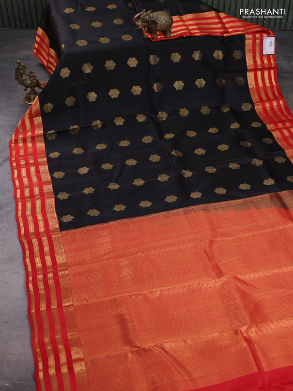 Kanchipuram silk saree black and orange with zari woven buttas and zari woven korvai border