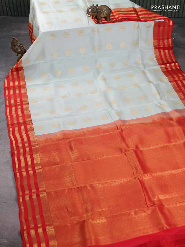 Kanchipuram silk saree pastel green shade and orange with zari woven buttas and zari woven korvai border