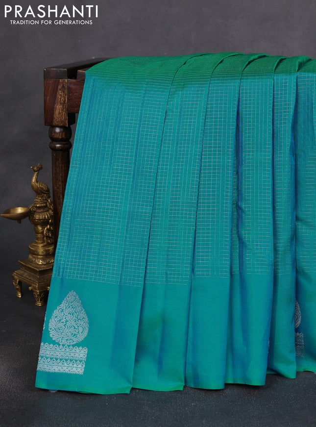 Pure soft silk saree dual shade of teal bluish green and yellow with allover silver zari checked pattern and paisley silver zari woven butta border
