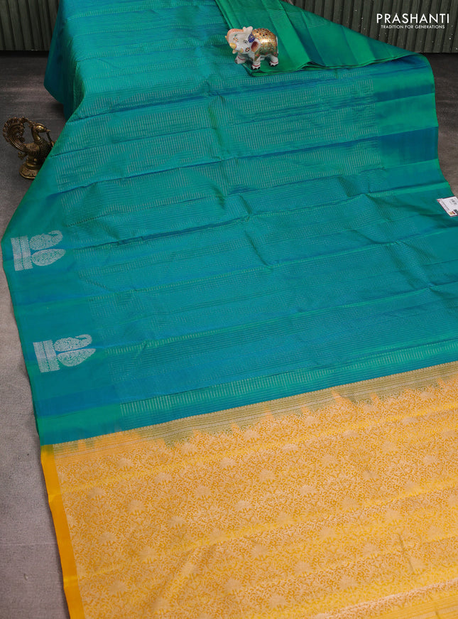 Pure soft silk saree dual shade of teal bluish green and yellow with allover silver zari checked pattern and paisley silver zari woven butta border