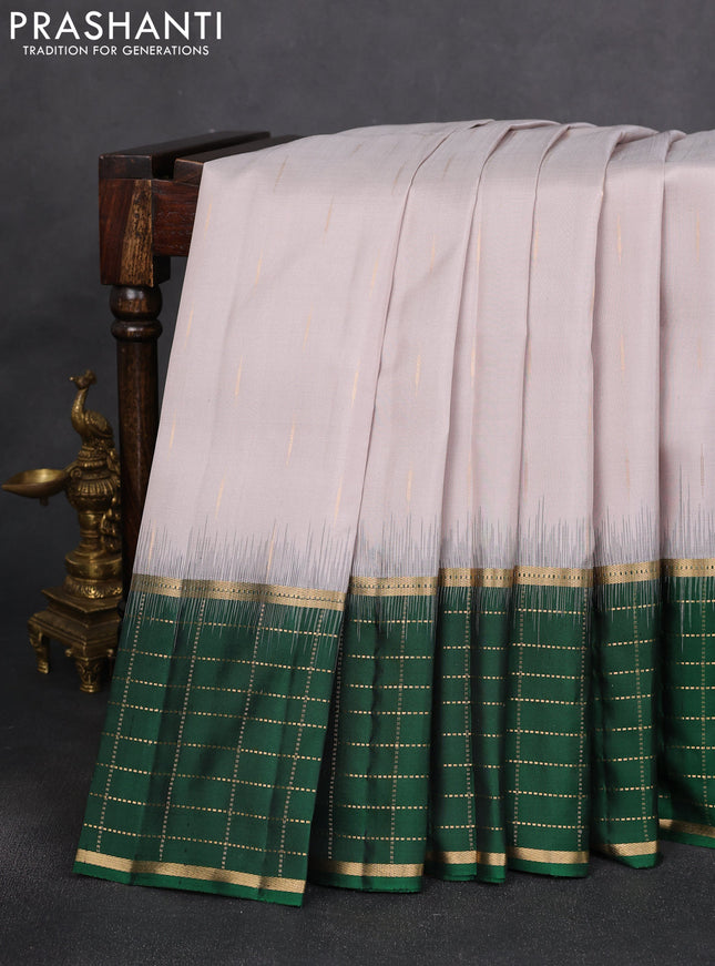 Pure soft silk saree pastel grey and green with zari woven buttas and long zari woven checked border