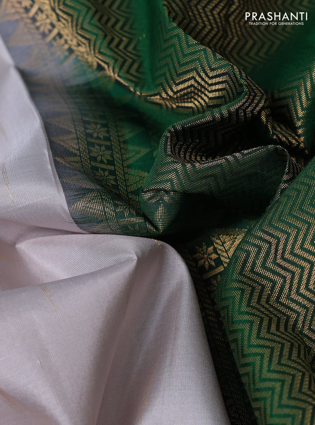 Pure soft silk saree pastel grey and green with zari woven buttas and long zari woven checked border