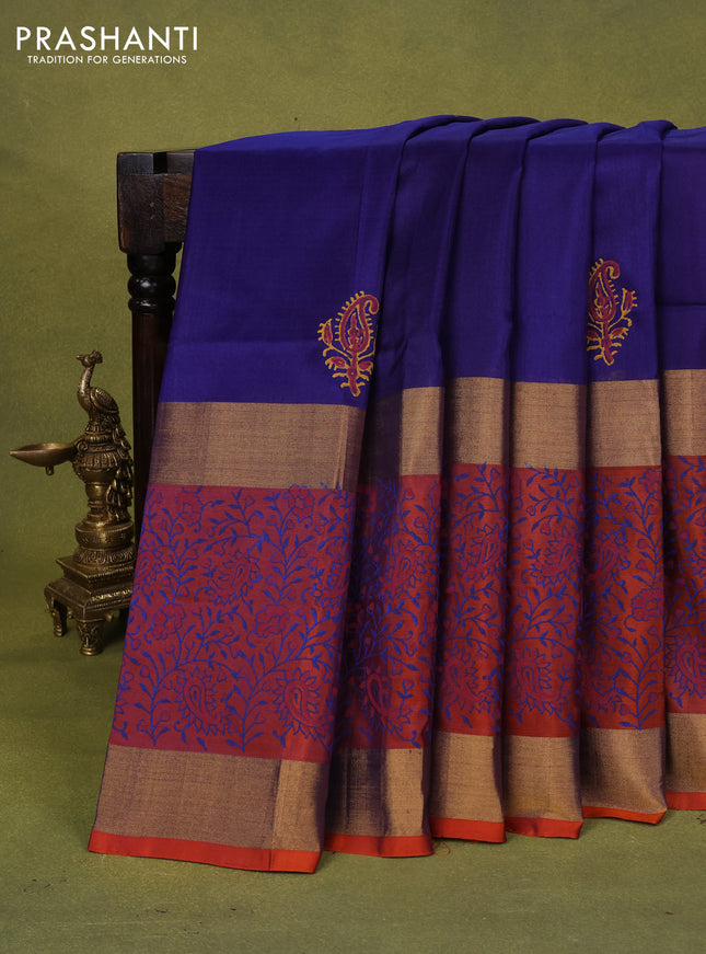 Uppada block printed silk saree blue and rust shade with paisley butta prints and long zari woven printed border