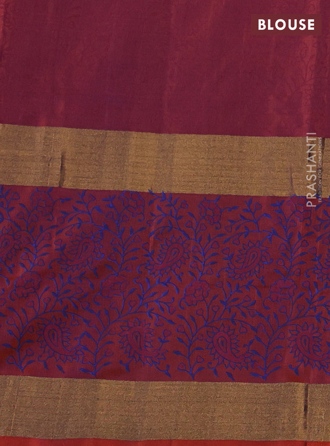 Uppada block printed silk saree blue and rust shade with paisley butta prints and long zari woven printed border