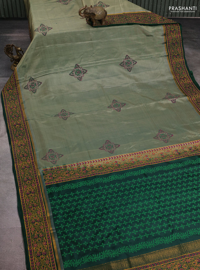 Uppada block printed silk saree pastel green and bottle green with allover prints and zari printed border