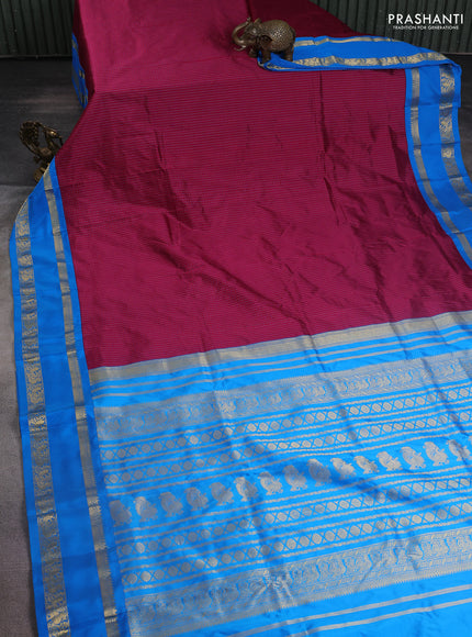 Narayanpet silk saree dark magenta and cs blue with allover small checked pattern and rettapet annam zari woven korvai border