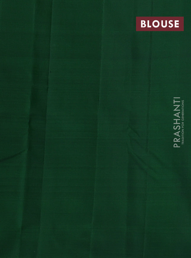 Pure kanchipuram silk saree dual shade of pinkish orange and green with zari woven buttas in borderless style