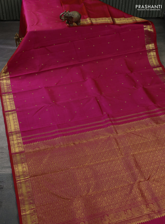 Pure kanchipuram silk saree dual shade of pinkish orange with zari woven buttas and zari woven border