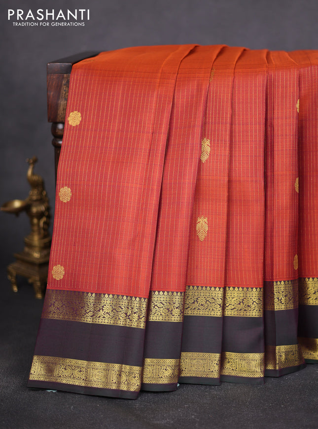 Pure kanchipuram silk saree rustic orange and bottle green with allover zari weaves & buttas and rettapet zari woven border
