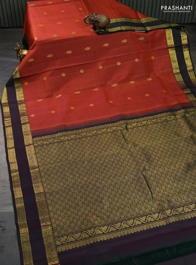 Pure kanchipuram silk saree rustic orange and bottle green with allover zari weaves & buttas and rettapet zari woven border