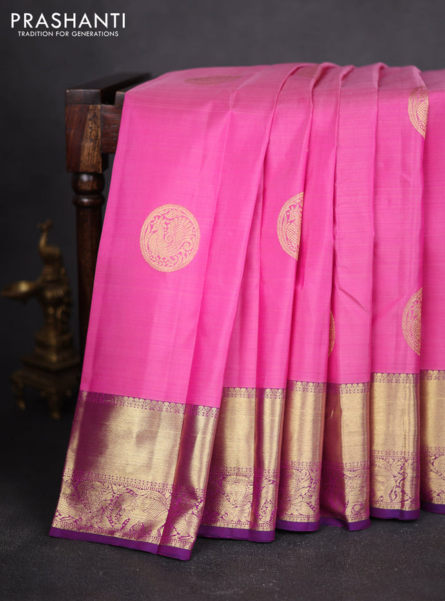 Pure kanchipuram silk saree light pink and purple with allover annam zari woven buttas and zari woven border