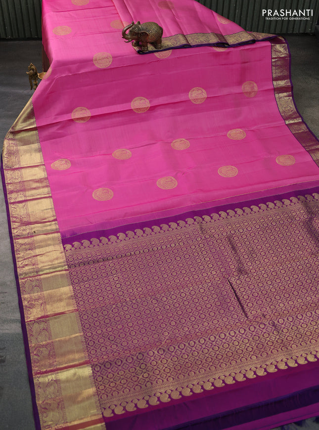 Pure kanchipuram silk saree light pink and purple with allover annam zari woven buttas and zari woven border