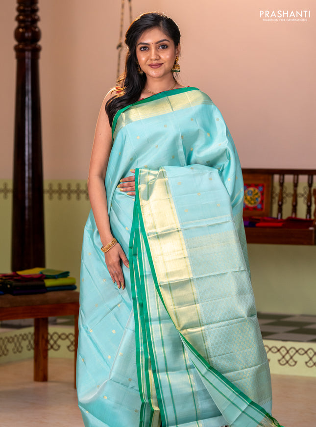 Pure kanchipuram silk saree teal blue and green with allover zari weaves & buttas and zari woven border