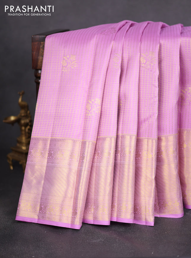 Pure kanchipuram silk saree lotus pink with allover zari checks & buttas and long zari woven border