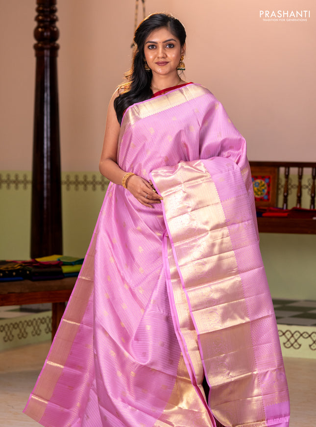 Pure kanchipuram silk saree light pink with allover zari checks & buttas and long zari woven border