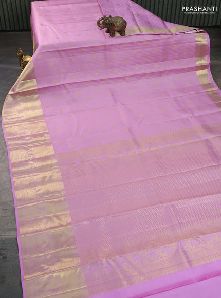 Pure kanchipuram silk saree light pink with allover zari checks & buttas and long zari woven border
