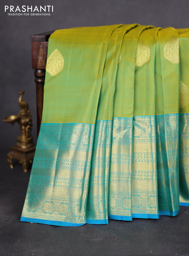 Pure kanchipuram silk saree light green and teal blue with zari woven buttas and long zari woven border
