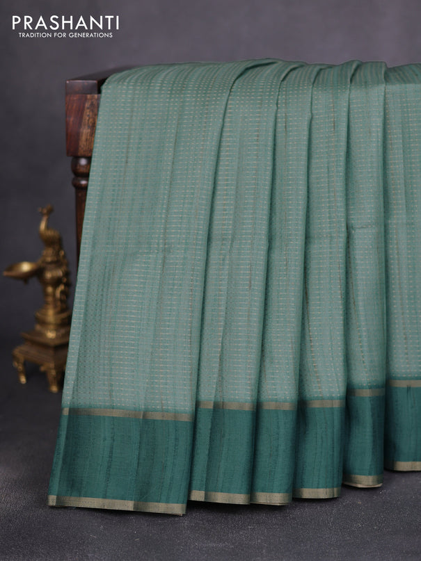Semi matka saree teal green with allover zari weaves and rettapet zari woven border