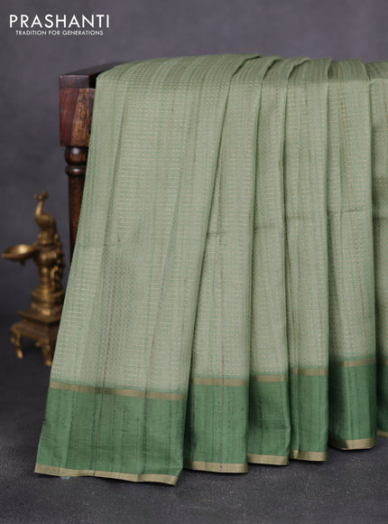 Semi matka saree light green with allover zari weaves and rettapet zari woven border