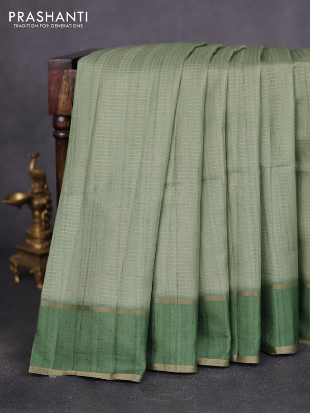 Semi matka saree light green with allover zari weaves and rettapet zari woven border