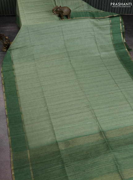 Semi matka saree light green with allover zari weaves and rettapet zari woven border