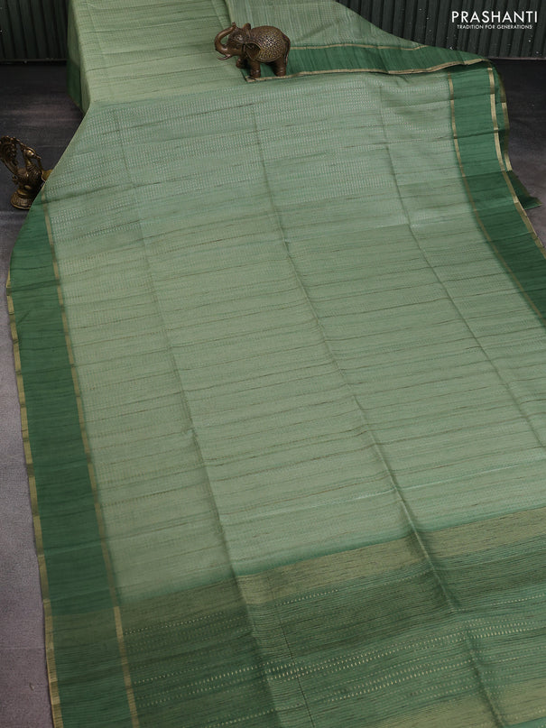 Semi matka saree light green with allover zari weaves and rettapet zari woven border