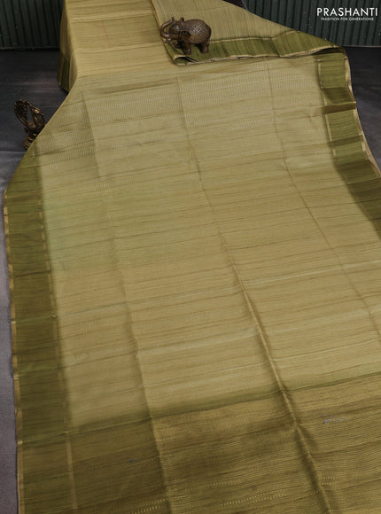 Semi matka saree mehendi green with allover zari weaves and rettapet zari woven border