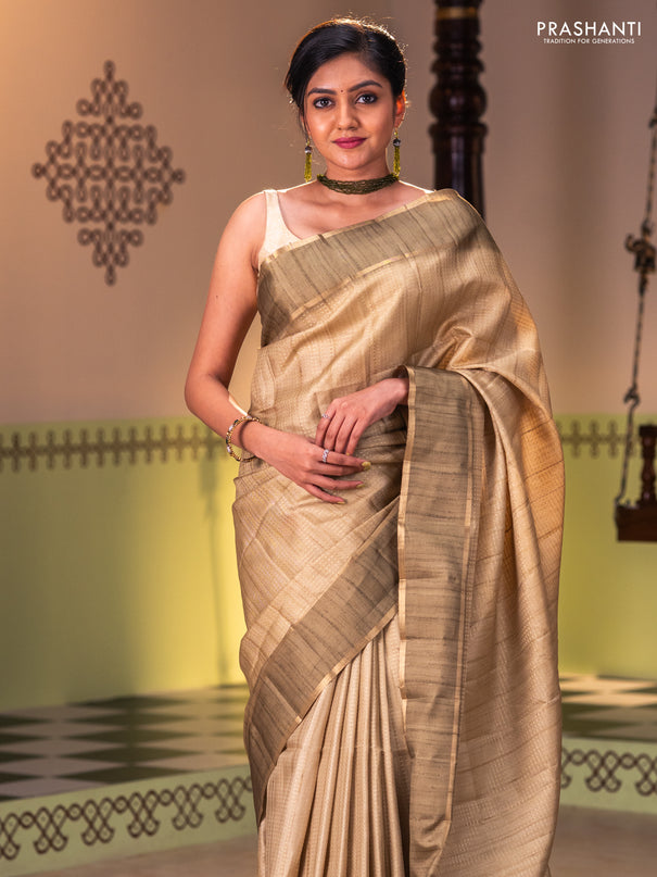 Semi matka saree dark mehendi green with allover zari weaves and rettapet zari woven border