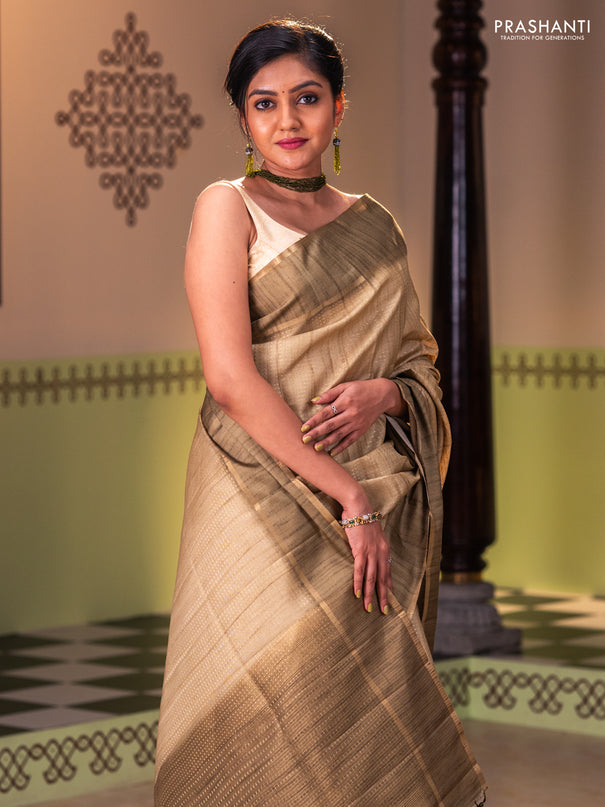Semi matka saree dark mehendi green with allover zari weaves and rettapet zari woven border