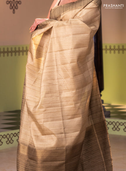 Semi matka saree dark mehendi green with allover zari weaves and rettapet zari woven border
