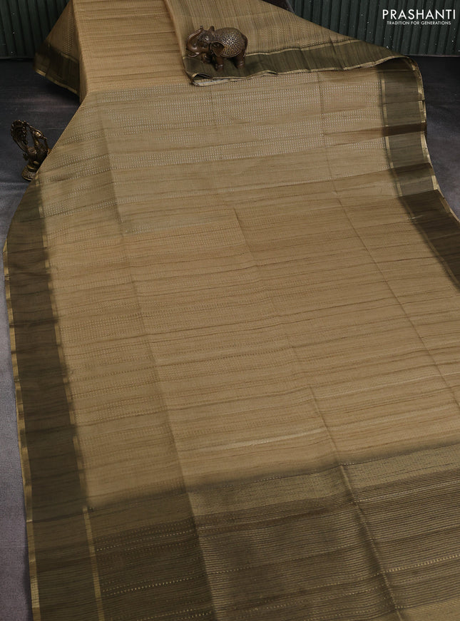 Semi matka saree dark mehendi green with allover zari weaves and rettapet zari woven border