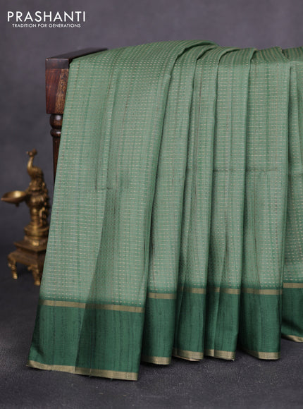 Semi matka saree green with allover zari weaves and rettapet zari woven border