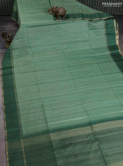 Semi matka saree green with allover zari weaves and rettapet zari woven border