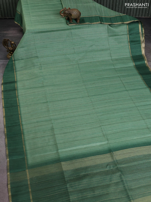 Semi matka saree green with allover zari weaves and rettapet zari woven border
