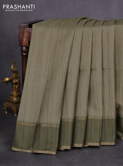Semi matka saree green with allover zari weaves and rettapet zari woven border