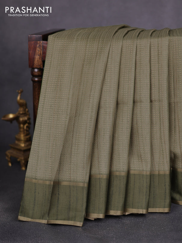 Semi matka saree green with allover zari weaves and rettapet zari woven border