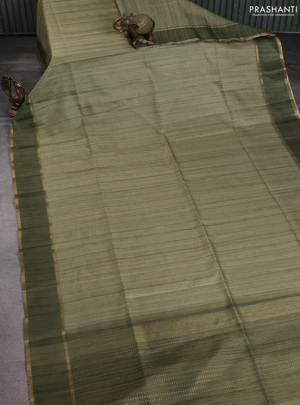 Semi matka saree green with allover zari weaves and rettapet zari woven border