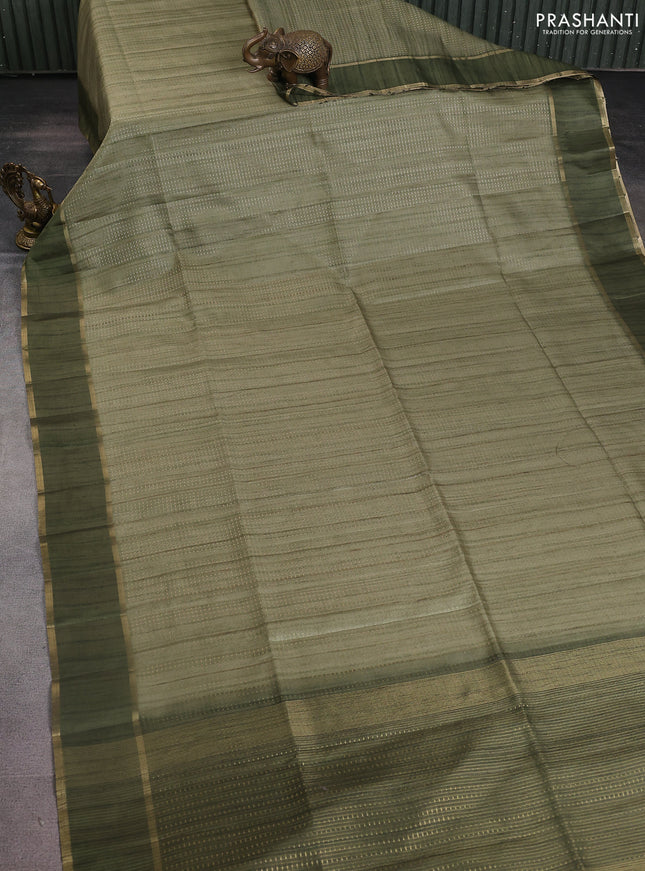 Semi matka saree green with allover zari weaves and rettapet zari woven border
