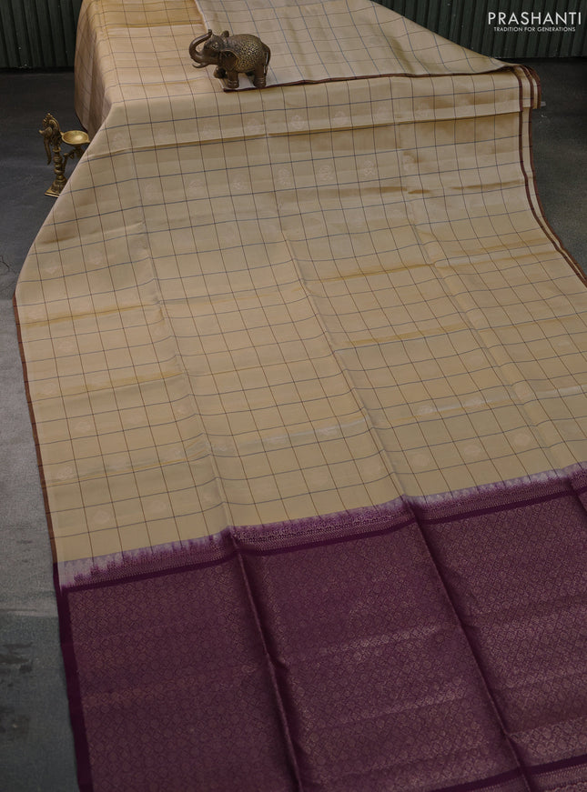 Pure soft silk saree sandal and deep purple with allover checks & zari buttas and piping border