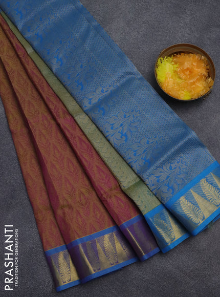 Silk cotton saree dual shade of purple and cs blue with allover self emboss jacquard and zari woven border