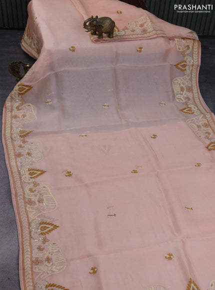 Pure organza silk saree peach shade with embroidery work buttas and kantha stitch work border