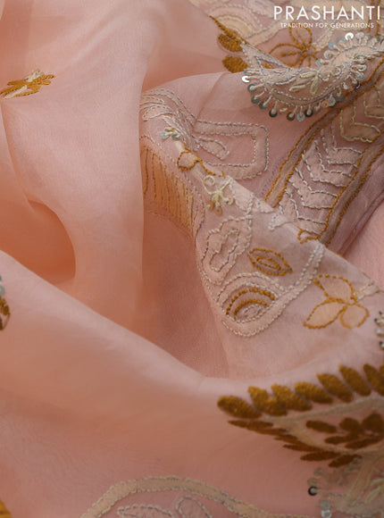 Pure organza silk saree peach shade with embroidery work buttas and kantha stitch work border