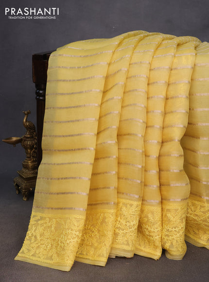 Pure organza silk saree yellow with allover zari weaves and embroidery work border