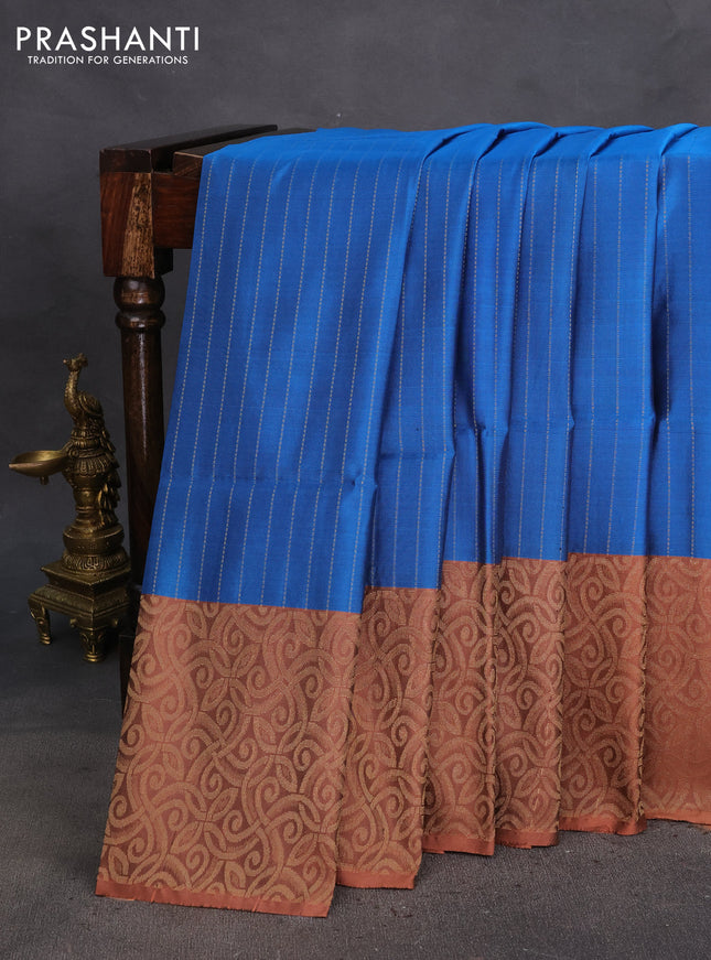 Kanchipuram soft silk saree peacock blue and pastel brown with allover zari weaves and piping border