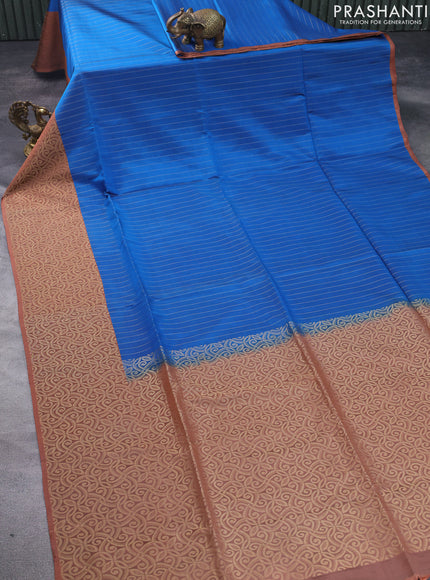 Kanchipuram soft silk saree peacock blue and pastel brown with allover zari weaves and piping border