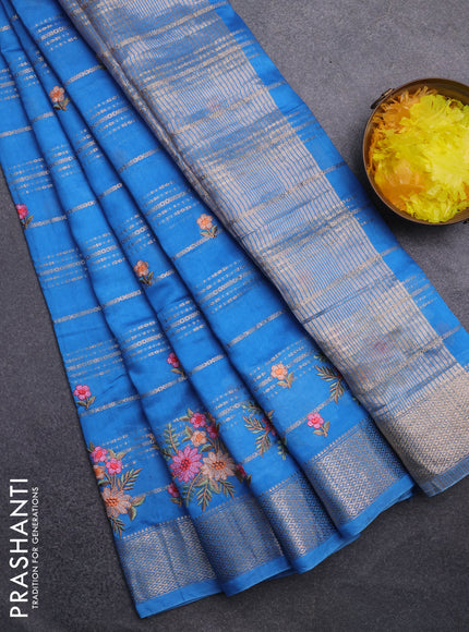 Assam silk saree cs blue with allover zari weaves & floral embroidery work buttas and zari woven border