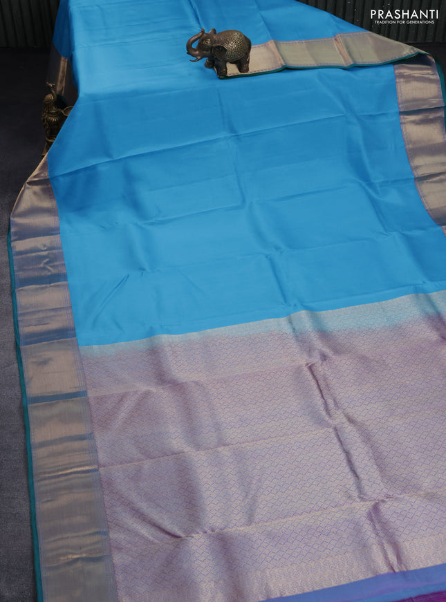 Pure kanchipuram silk saree light blue and dual shade of bluish pink with plain body and rich zari woven border
