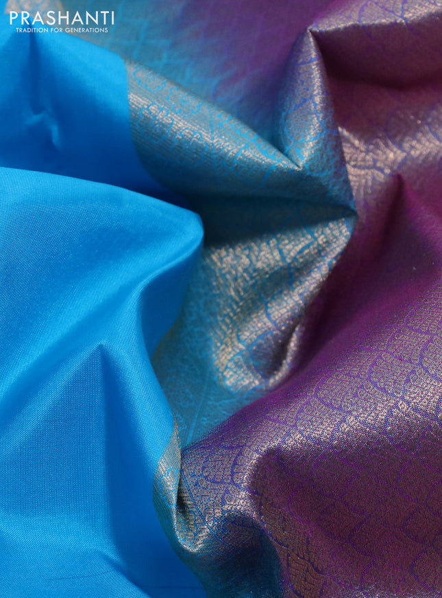 Pure kanchipuram silk saree light blue and dual shade of bluish pink with plain body and rich zari woven border