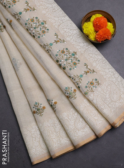 Off White & Teal Green Linen Saree - Embroidery